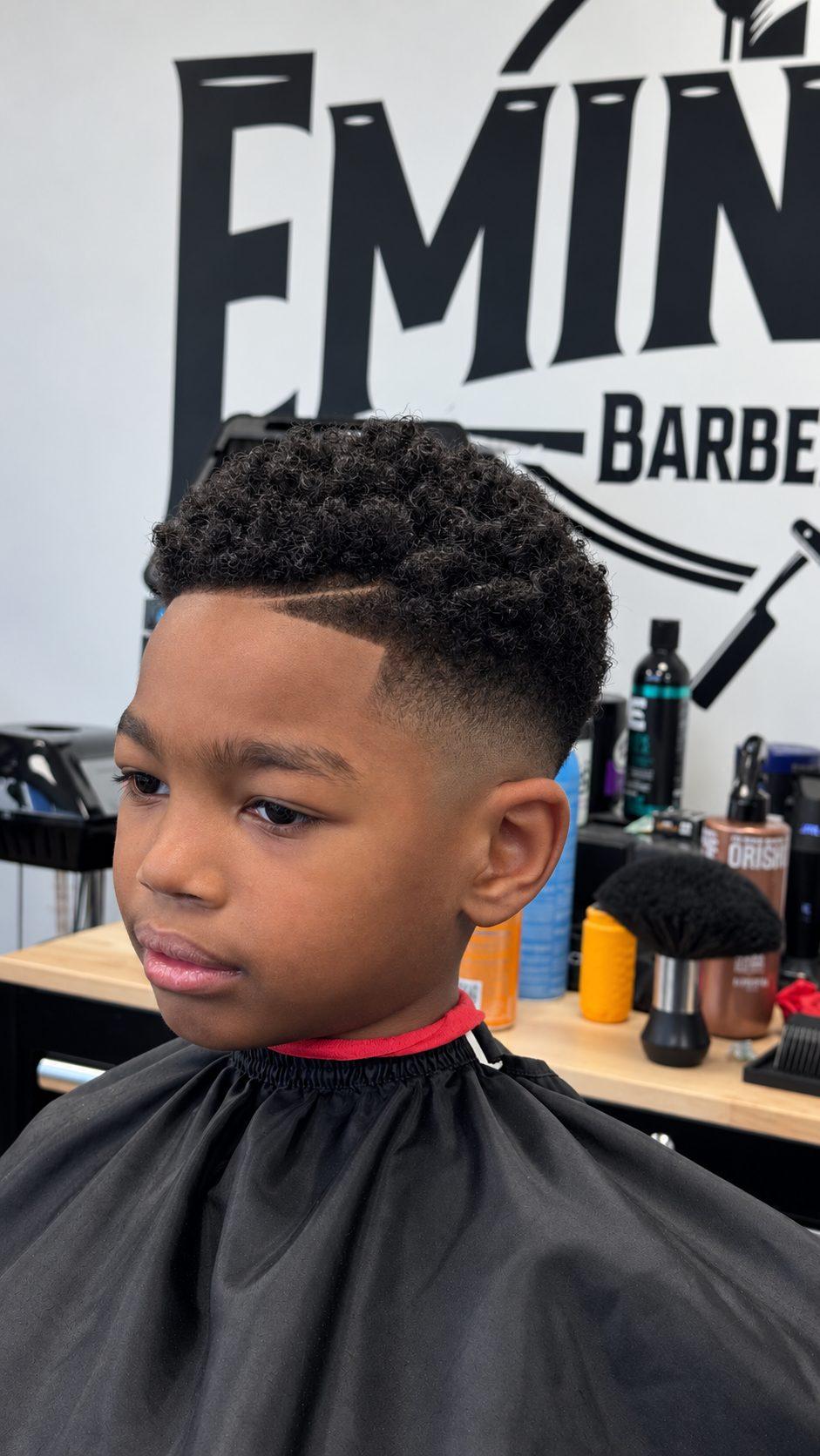 Young fade with hard part and twists at Eminence Barbersuite, North Plainfield NJ