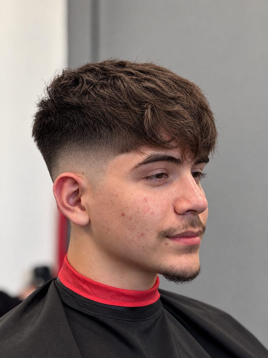 Mid skin fade with crop on top at Eminence Barbersuite, North Plainfield NJ